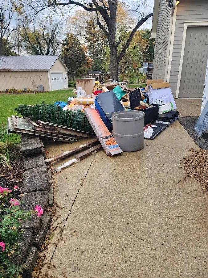 Dumpster being loaded with debris for 30 Yard Dumpster Rental in Hephzibah